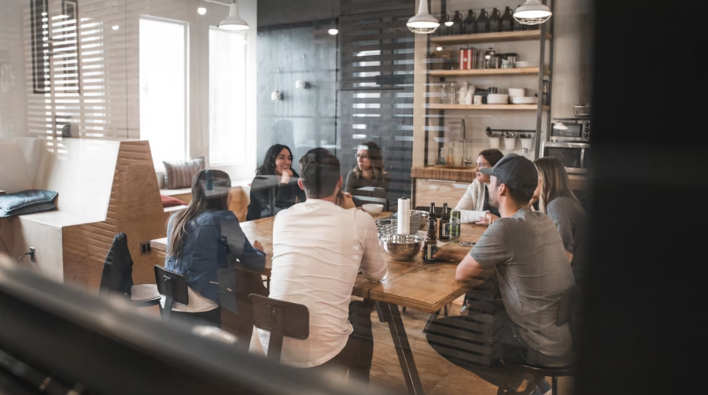 Group of Coworkers Sitting Around a Restaurant Table